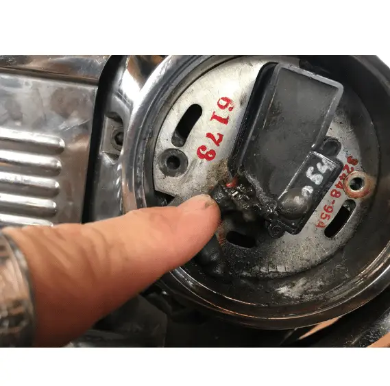 Motorcycle mechanic points to potential issue during Harley Davidson no spark troubleshooting
