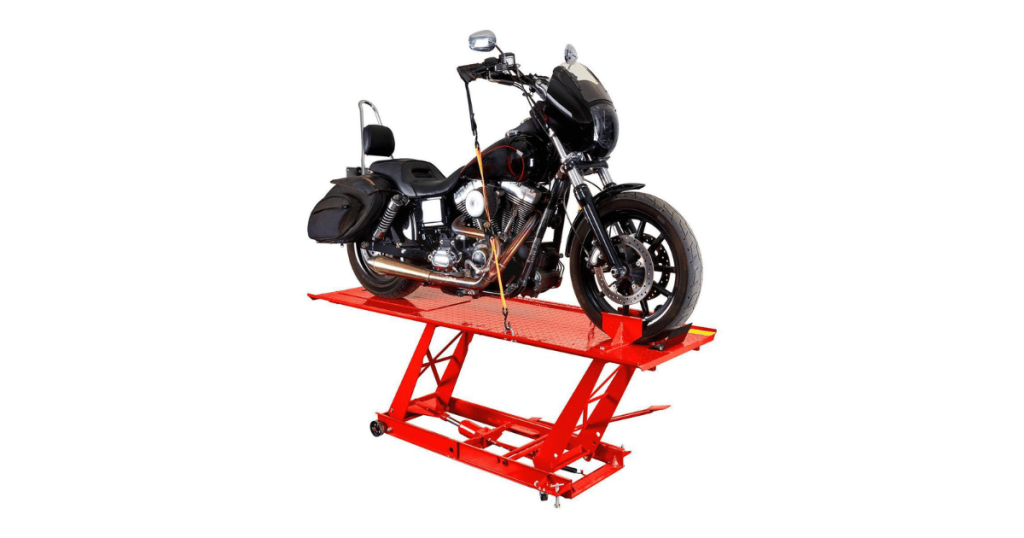 A black Harley motorcycle on a lift to have its starting problems repaired